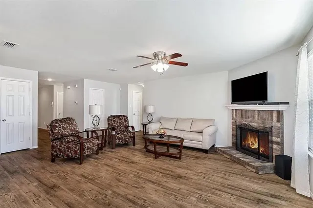 a living room with furniture and a fireplace