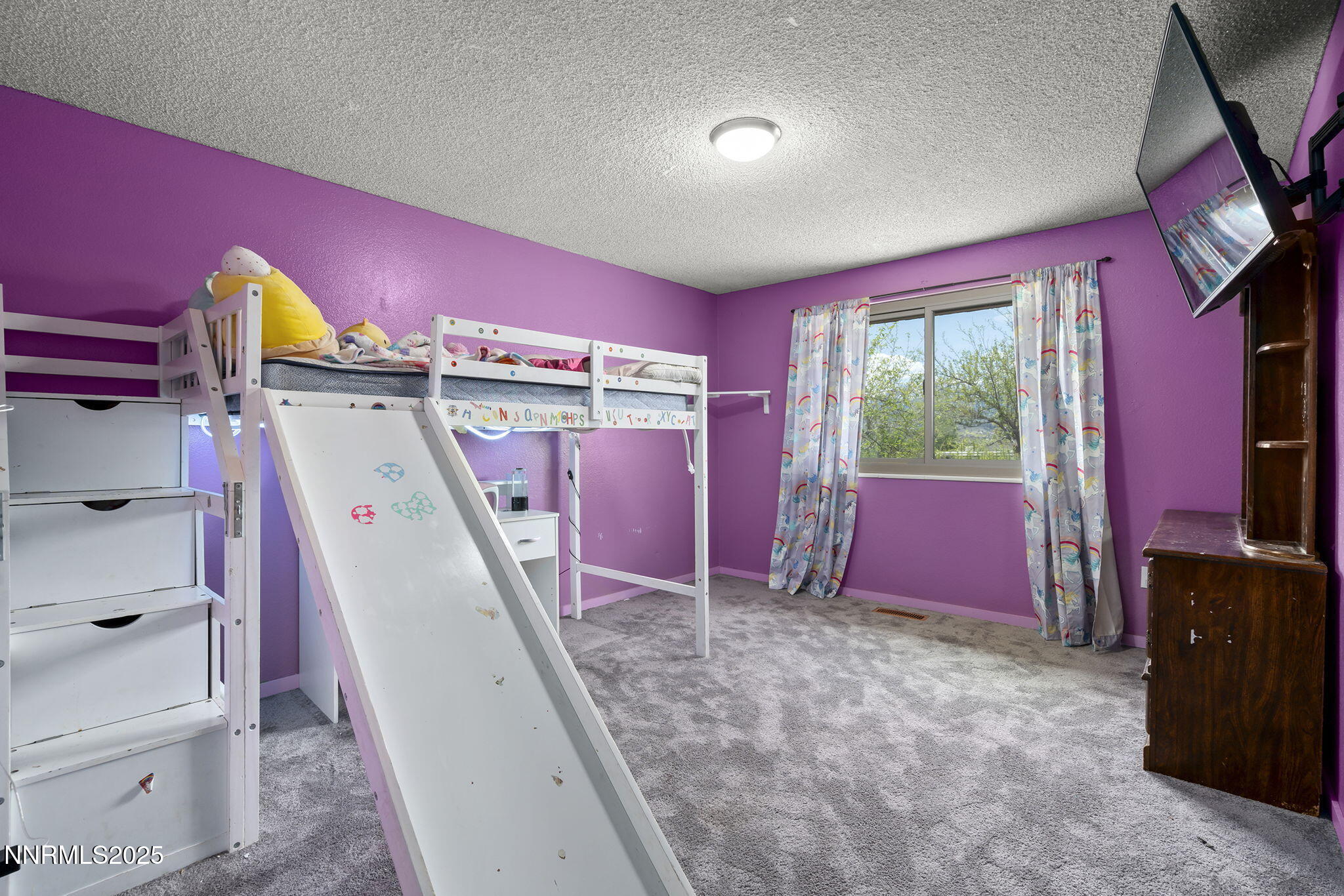 14590 Rancheros Drive Reno, NV 89521 - Photo 18 of 31 a view of a livingroom with furniture and a window