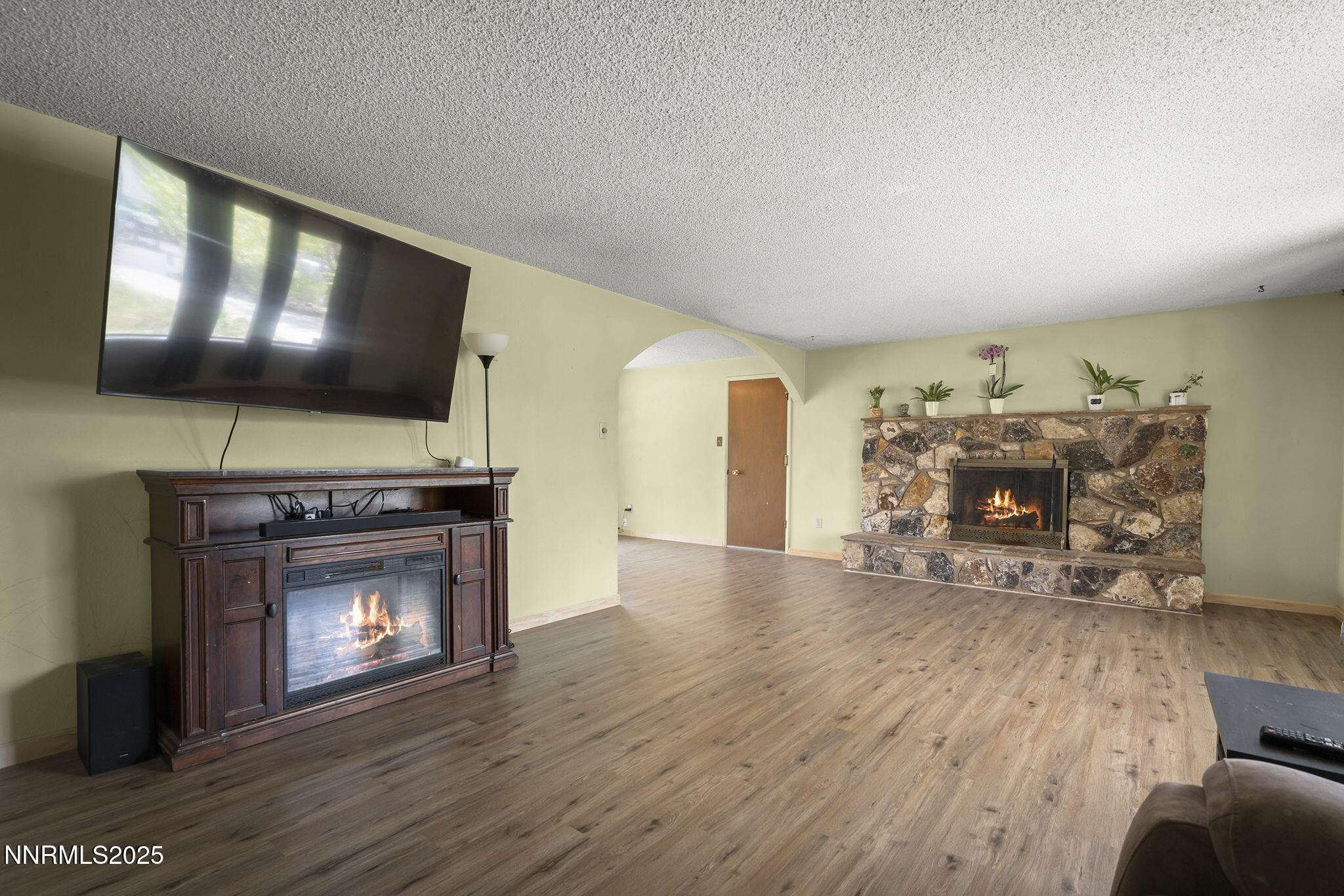 14590 Rancheros Drive Reno, NV 89521 - Photo 8 of 31 a living room with furniture and a fireplace