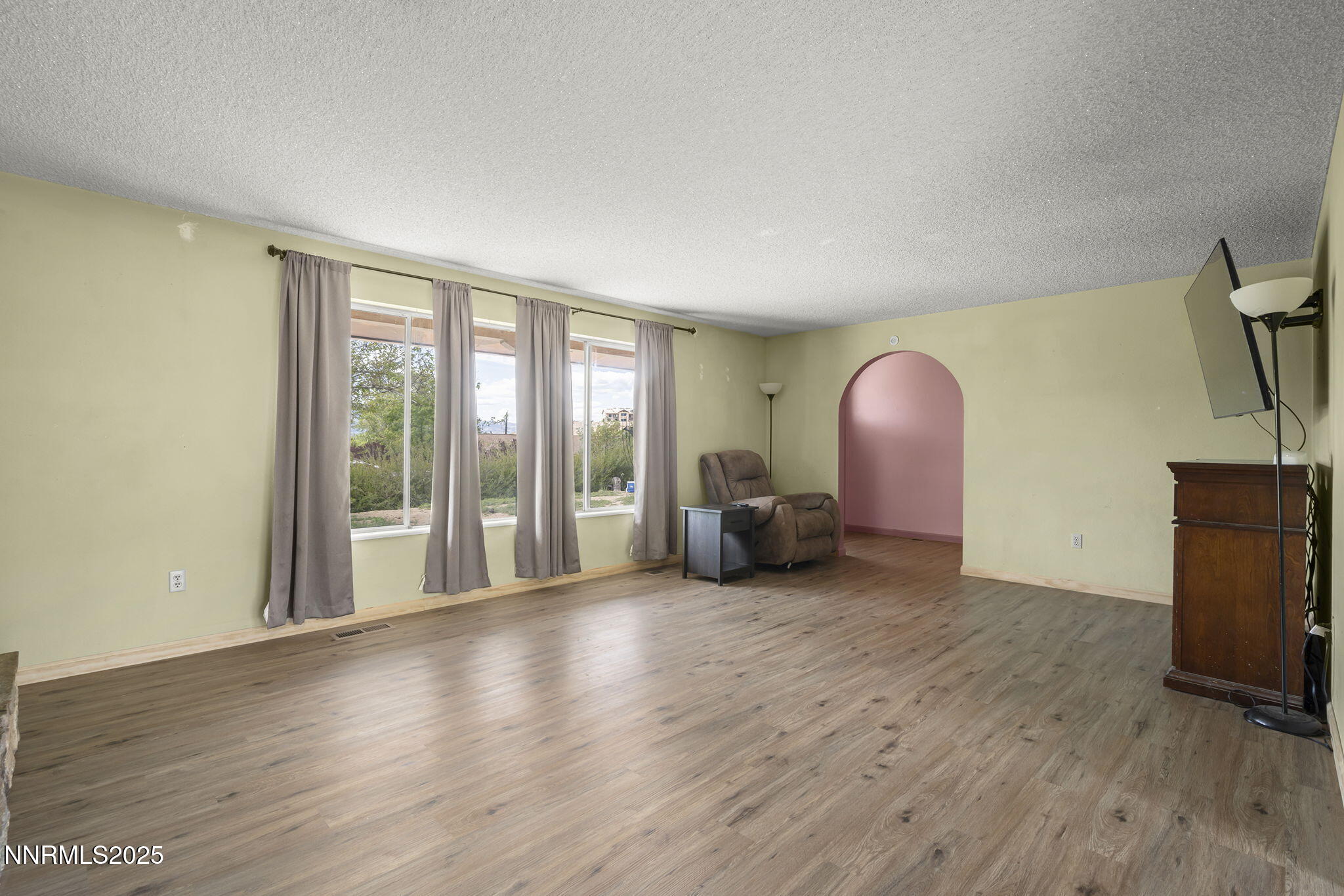14590 Rancheros Drive Reno, NV 89521 - Photo 10 of 31 a view of livingroom with furniture and a fireplace