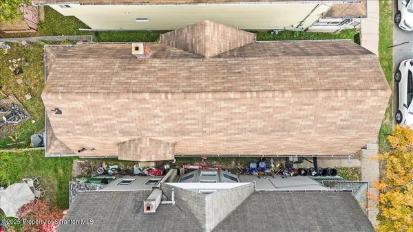 a view of swimming pool with outdoor seating and yard in the back