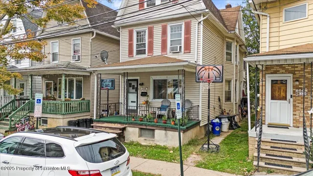 a front view of a house with a porch