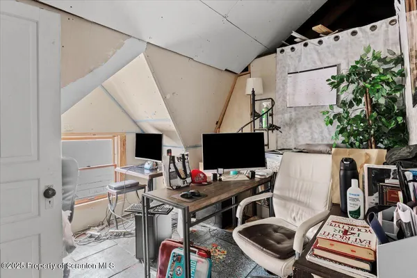 a view of workspace with wooden floor windows