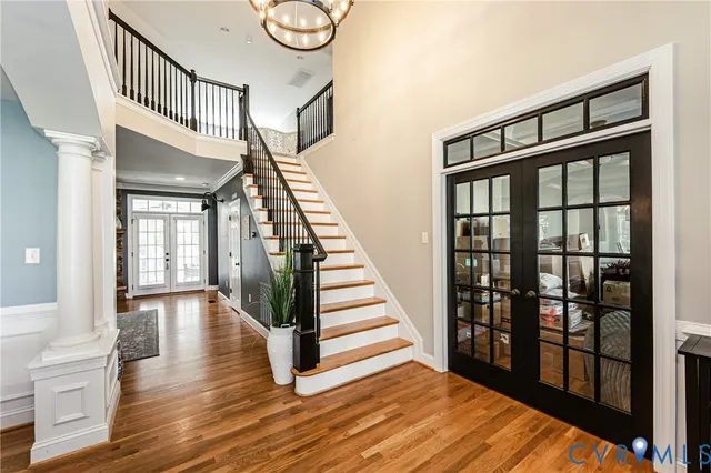 a view of entryway with stairs and wooden floor