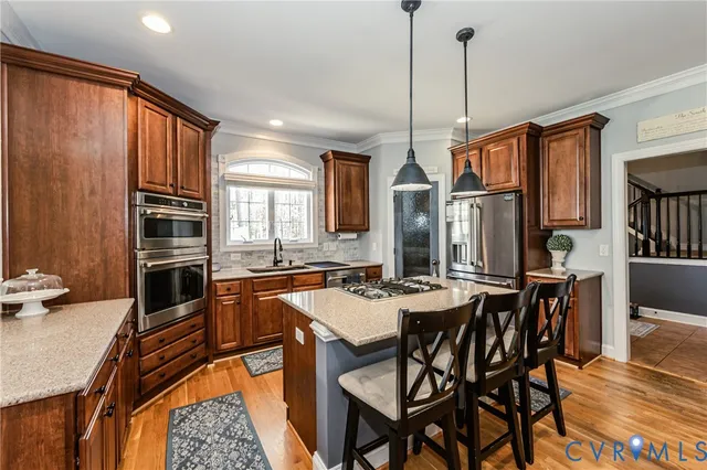 a dining table with chairs and kitchen view