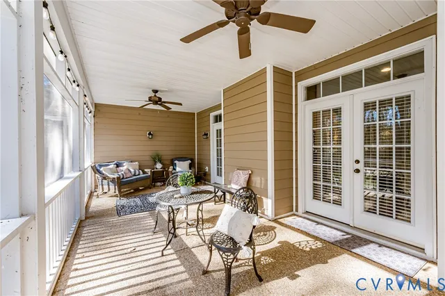 a view of a patio with a table and chairs