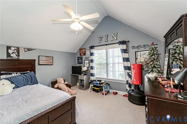 a bedroom with bed and a large window
