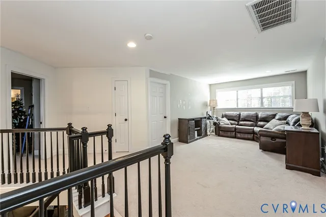 a view of a livingroom with furniture and windows
