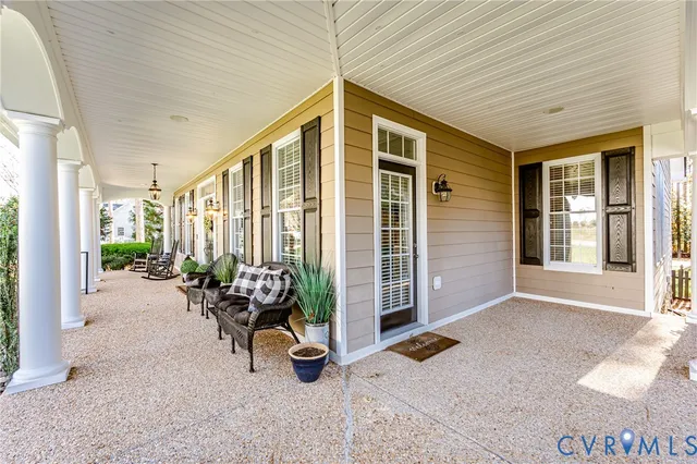 a front view of a house with outdoor seating