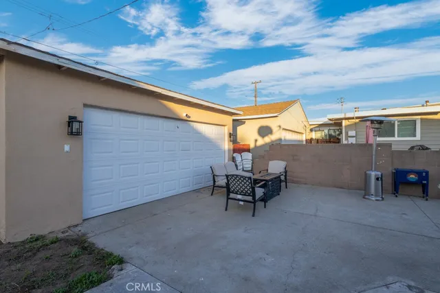 a view of a backyard with plants and a big yard