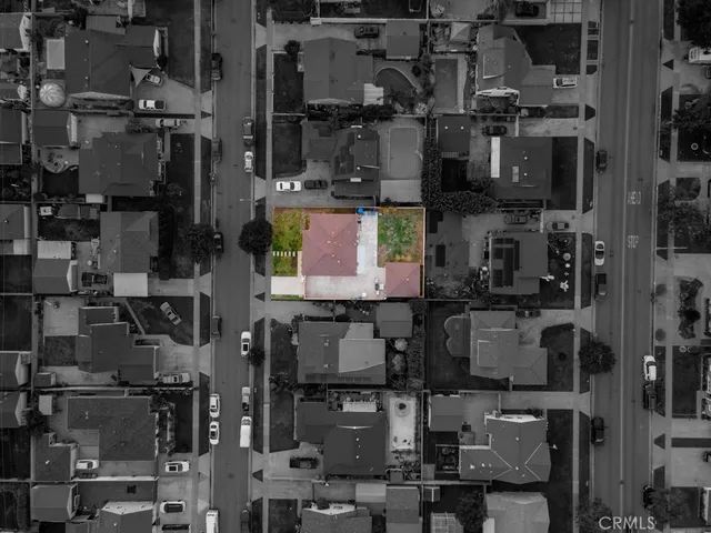 an aerial view of multiple houses with yard