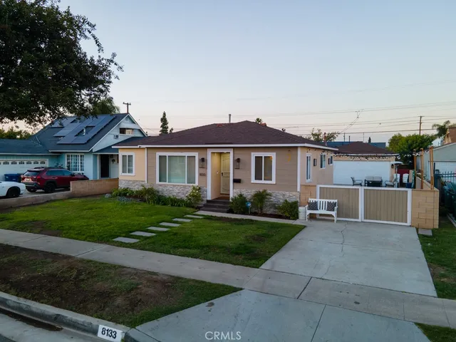 an aerial view of residential houses with outdoor space and street view