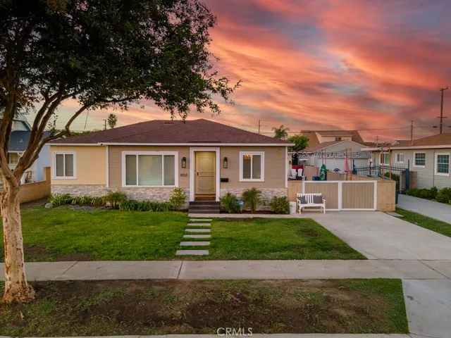 an aerial view of multiple houses with a swimming pool
