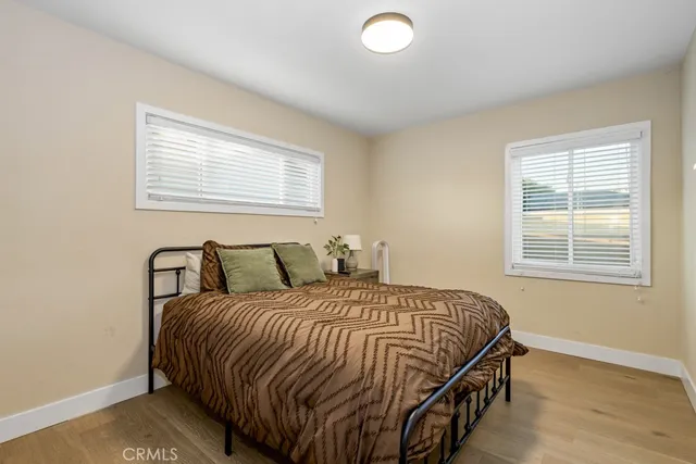 a bathroom with a shower a toilet and a sink