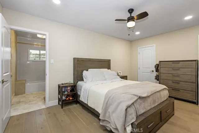 a large white kitchen with cabinets