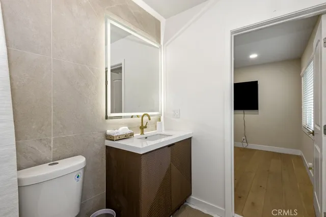 a stove top oven sitting inside of a kitchen