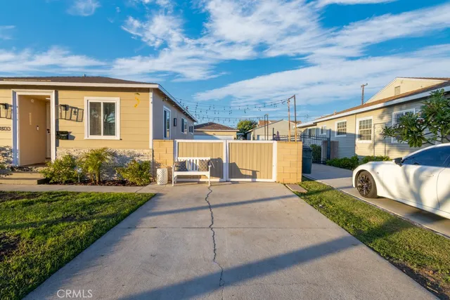 a view of a house with a garage and a table