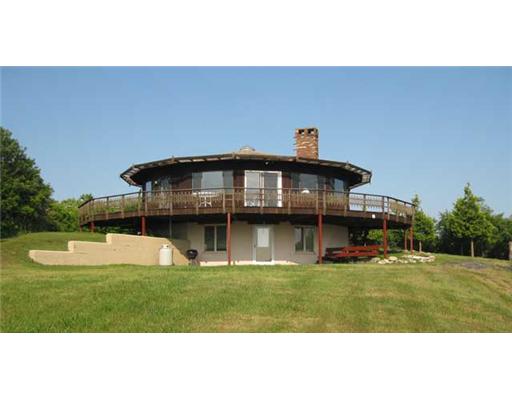 987 Cooneymus Road Block Island, RI 02807 - Photo 1 of 7 Exterior Front. Enjoy panoramic views of the Ocean. Montauk L.I., and RI and CT shorelines from inside and outside of this home. Sunsets are spectacular from this site.