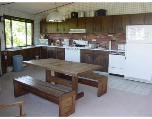 987 Cooneymus Road Block Island, RI 02807 - Photo 3 of 7 Kitchen. Open kitchen/dining/living area is spacious and offers views.