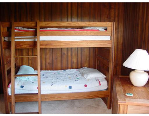 987 Cooneymus Road Block Island, RI 02807 - Photo 7 of 7 Bedroom. The bunk room has the washer and dryer in the closet.