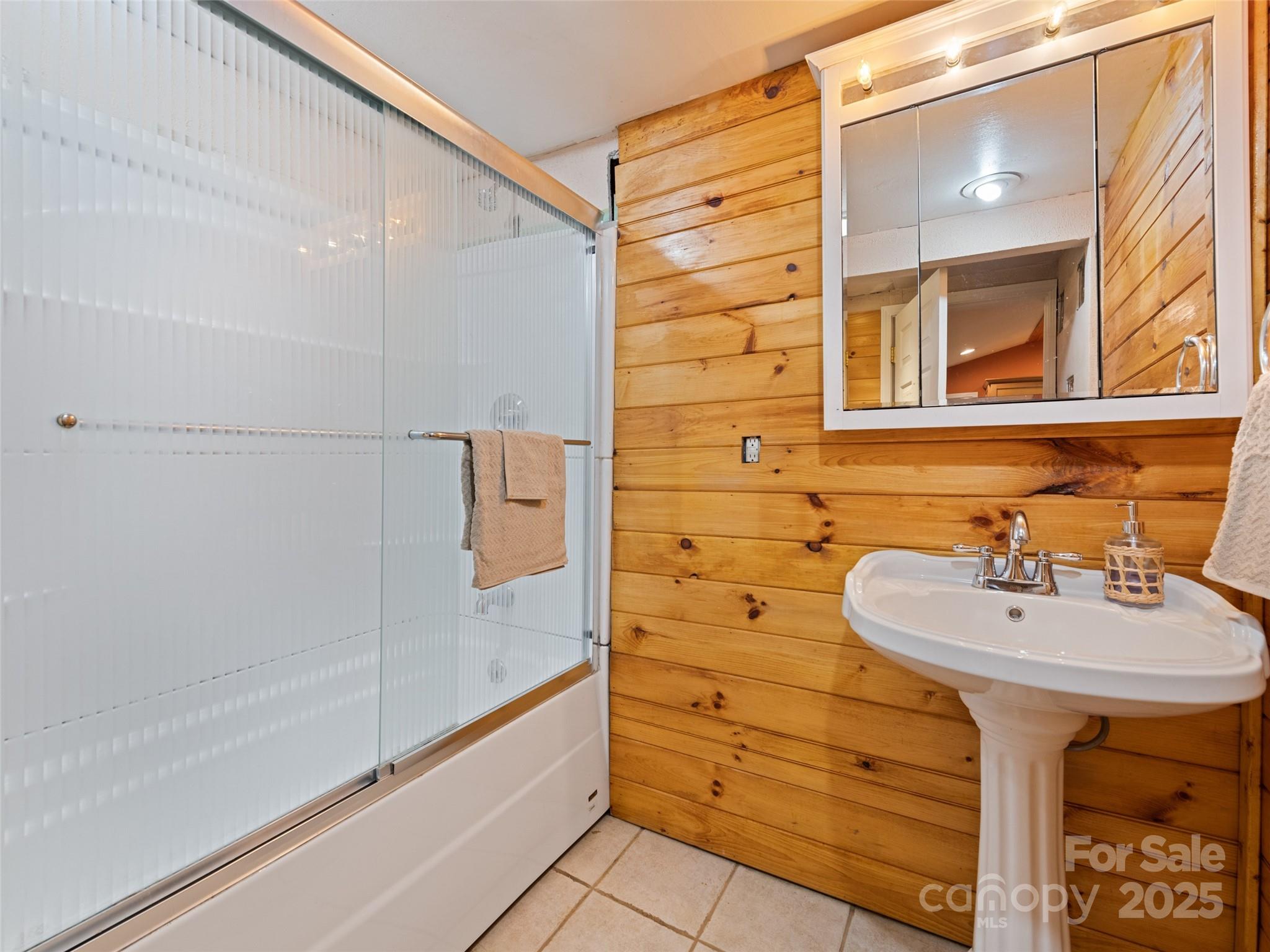 3383 Thickety Road Clyde, NC 28721 - Photo 16 of 33 a bathroom with a sink and a mirror