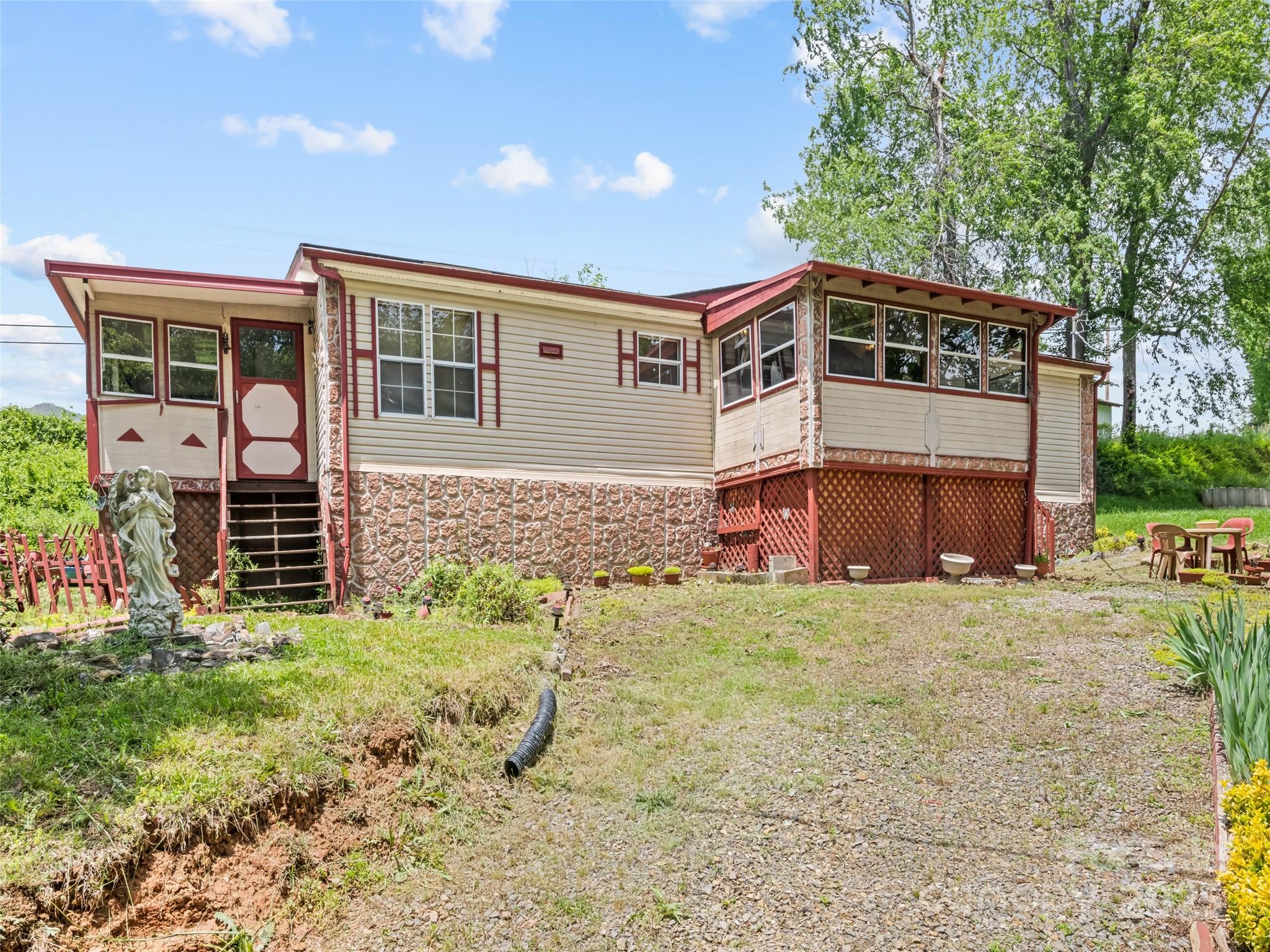 3383 Thickety Road Clyde, NC 28721 - Photo 2 of 33 a front view of a house with a yard