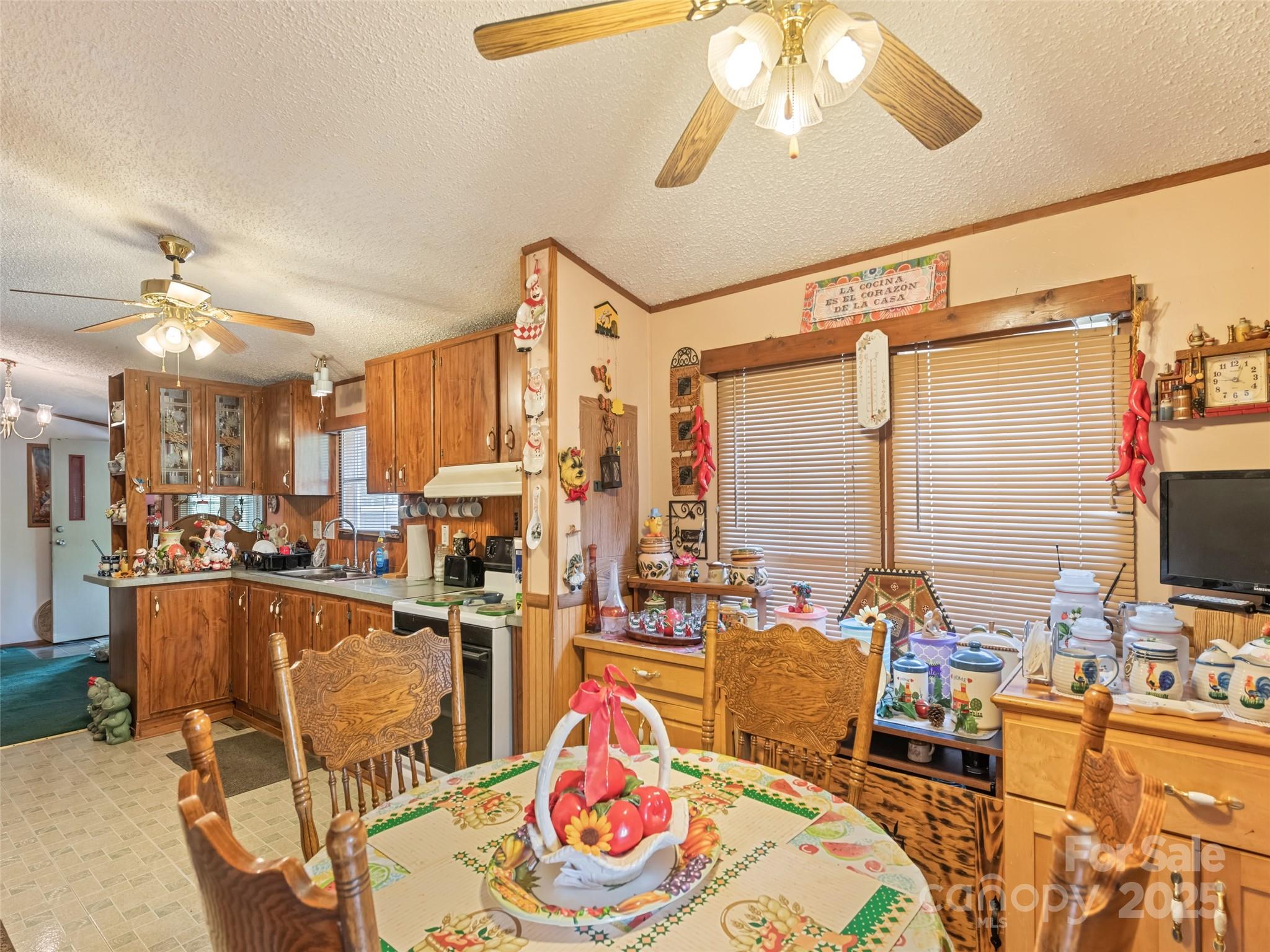 3383 Thickety Road Clyde, NC 28721 - Photo 26 of 33 a living room with furniture and a flat screen tv