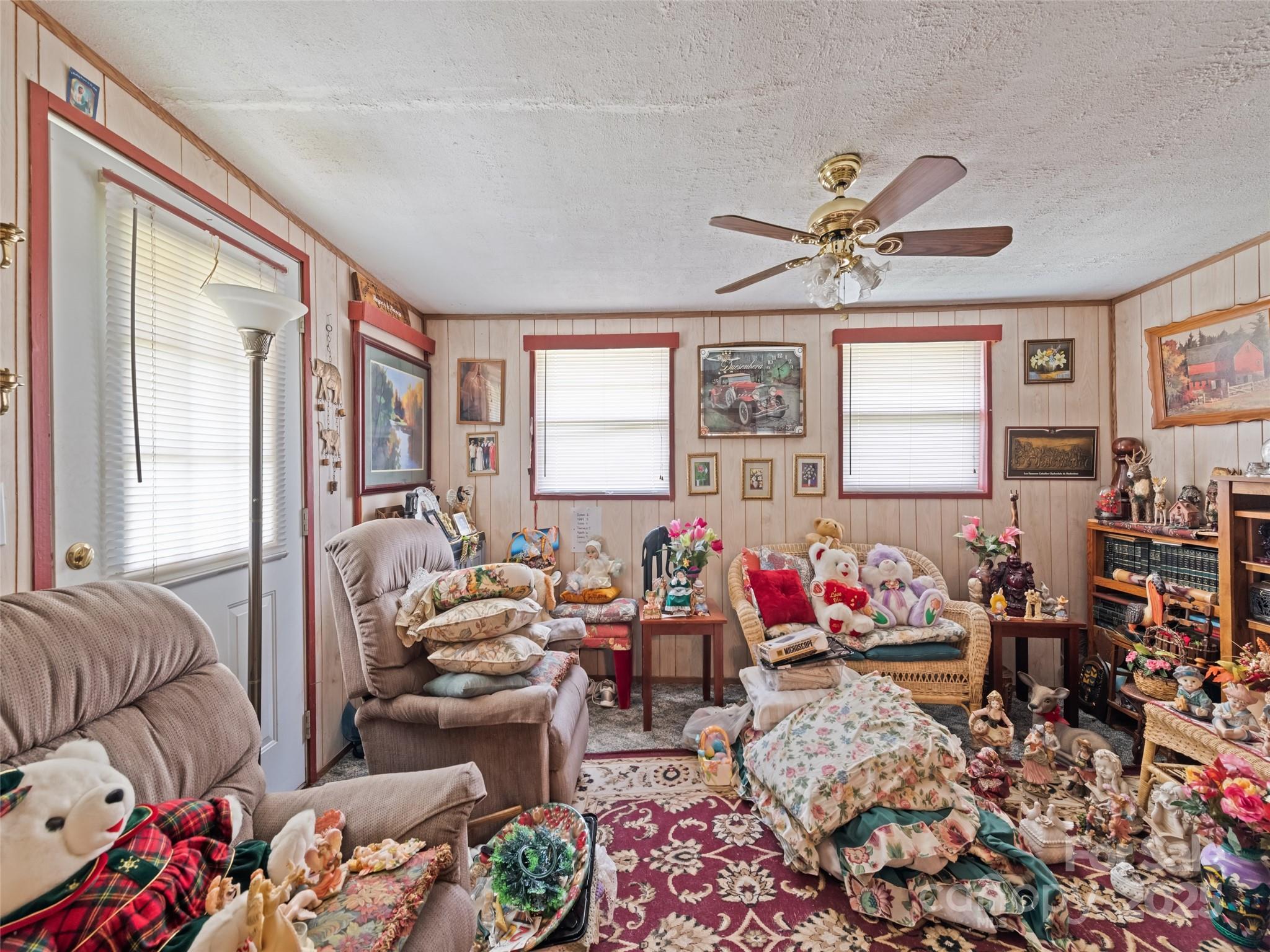 3383 Thickety Road Clyde, NC 28721 - Photo 28 of 33 a living room with furniture chess board and a rug