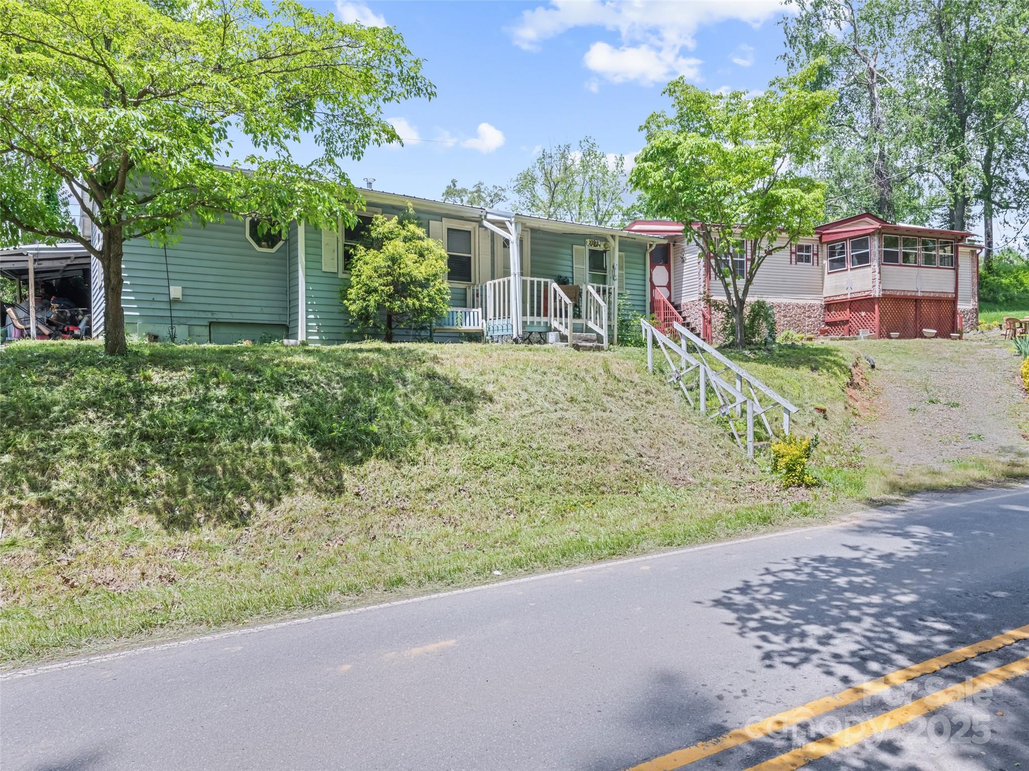 3383 Thickety Road Clyde, NC 28721 - Photo 4 of 33 front view of a house with a yard
