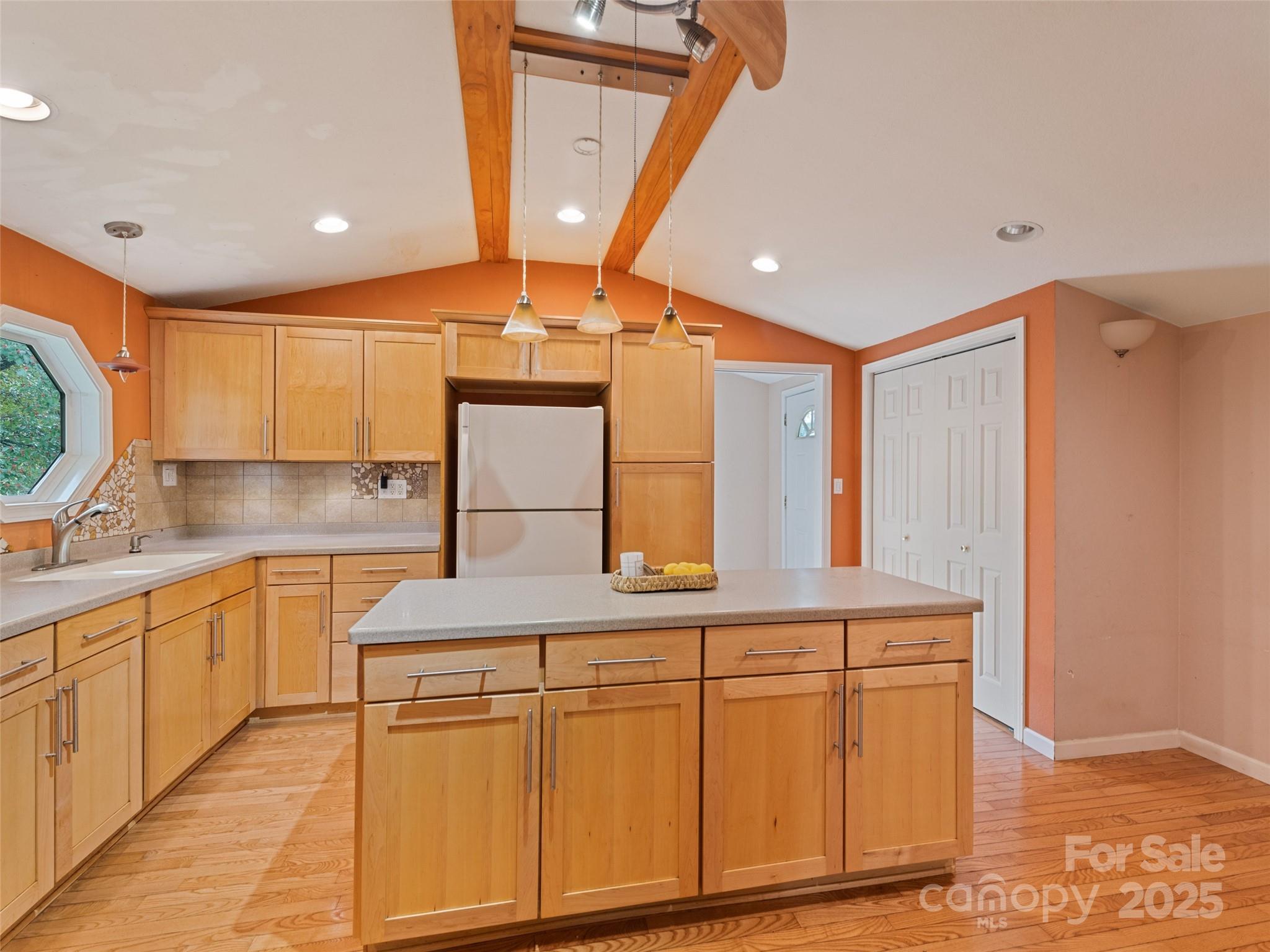 3383 Thickety Road Clyde, NC 28721 - Photo 10 of 33 a kitchen with white cabinets and sink