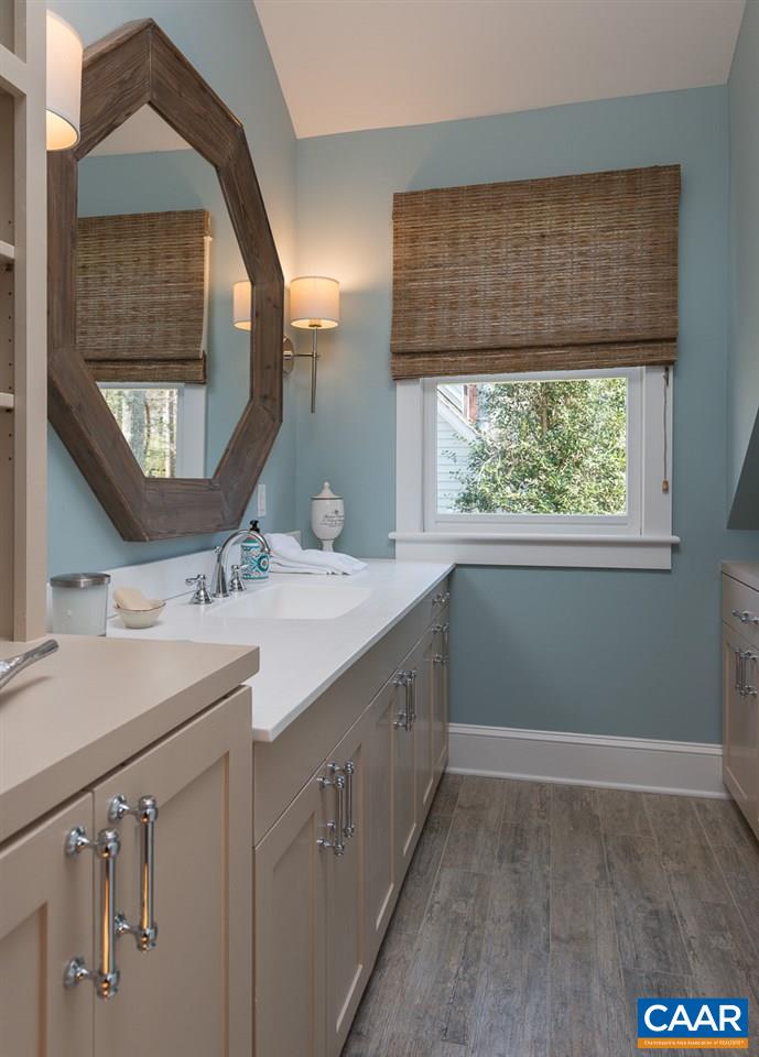 2623 Free Union Road Charlottesville, VA 22901 - Photo 23 of 32 a bathroom with a sink and a mirror