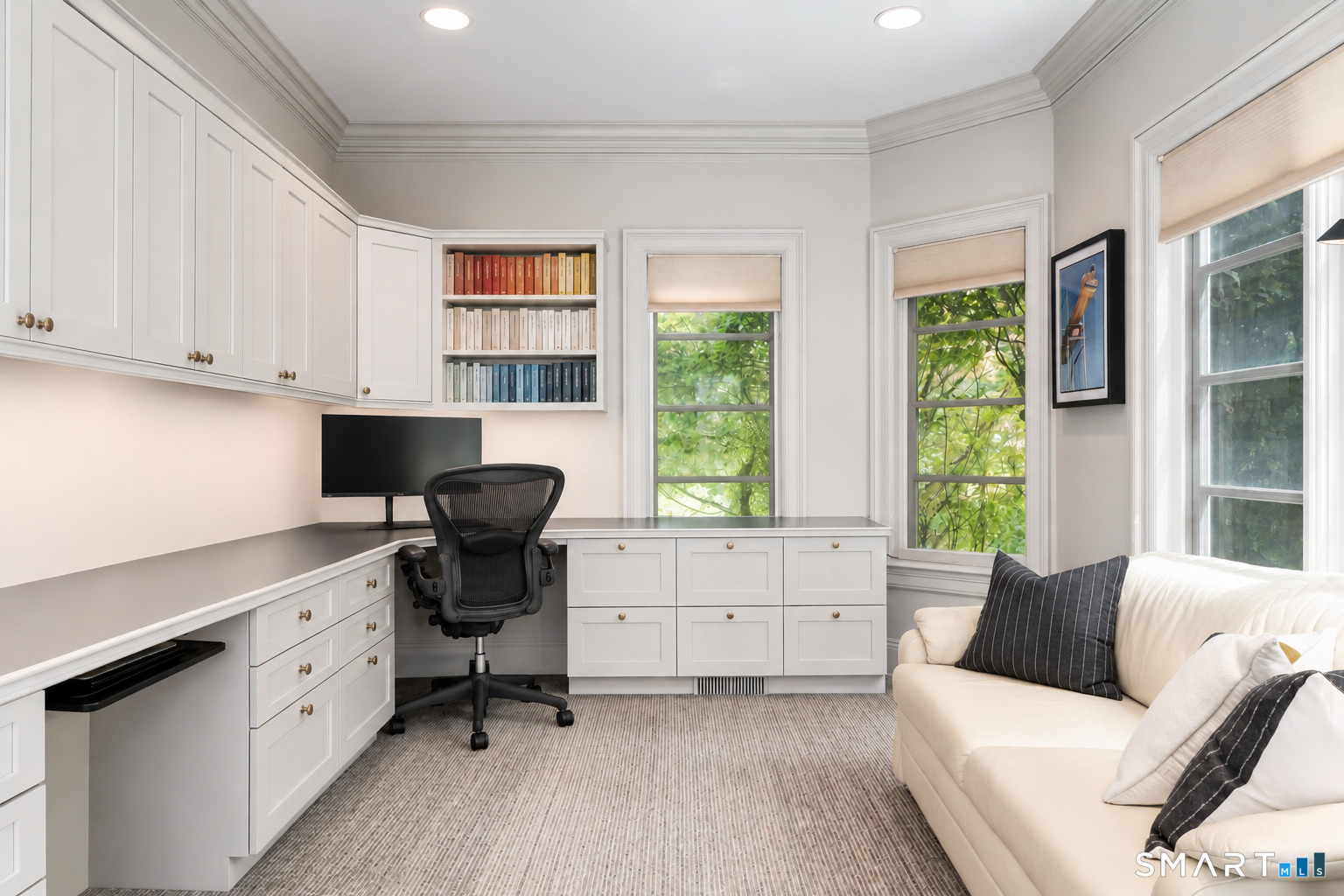 760 Smith Ridge Road New Canaan, CT 06840 - Photo 12 of 40 a view of a workspace with furniture and a window