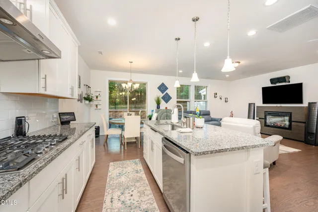 a bathroom with a sink mirror and toilet