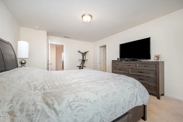 a bathroom with double vanity sink and a mirror