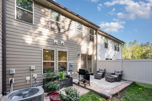 a view of a two chairs in the balcony