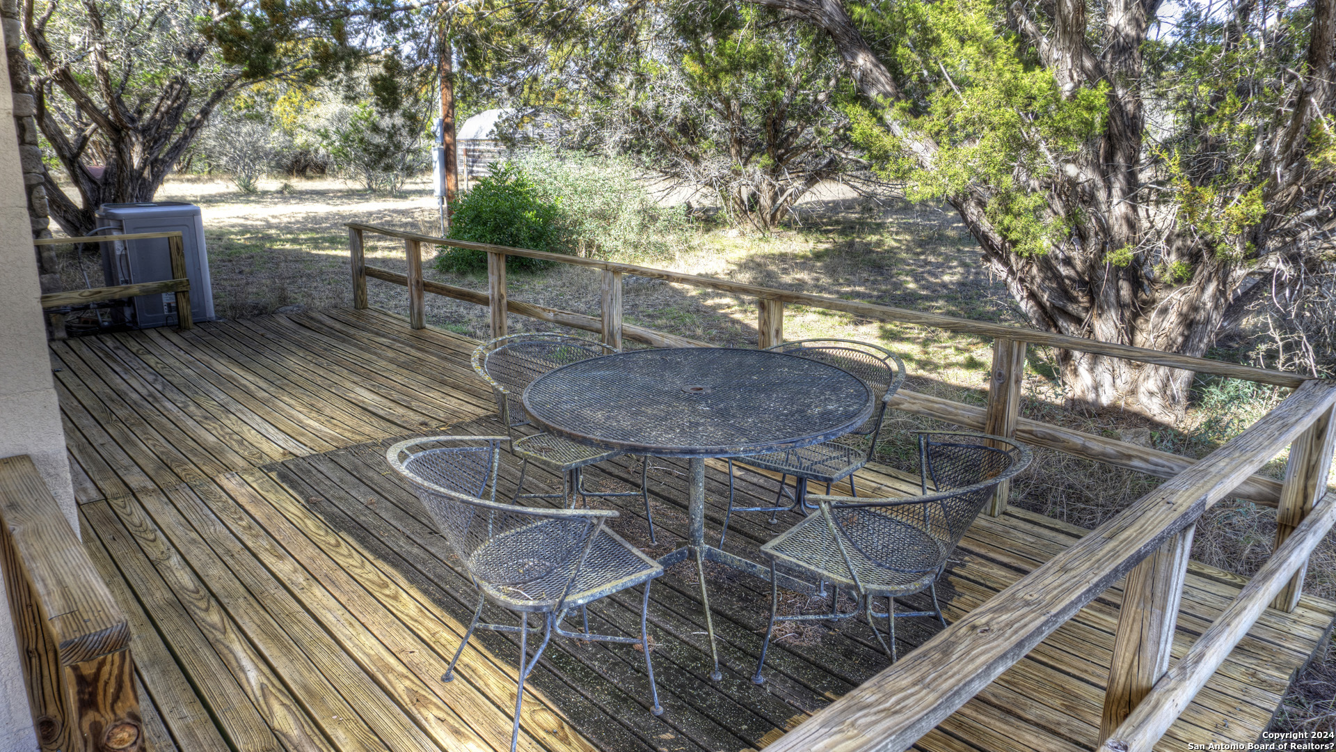 22 Squirrel Bend Uvalde, TX 78801 - Photo 15 of 47 a view of a chairs and table on the wooden roof deck