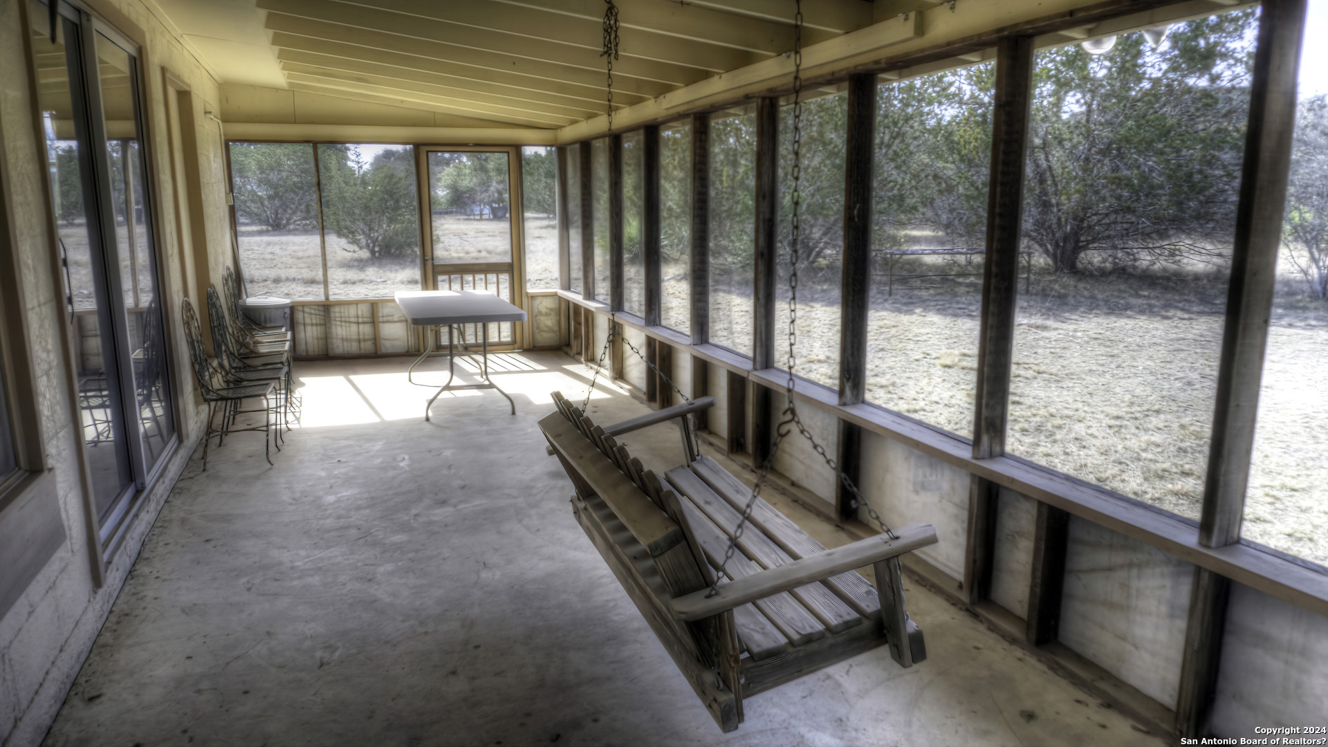 22 Squirrel Bend Uvalde, TX 78801 - Photo 19 of 47 a view of a large room with wooden floor and windows