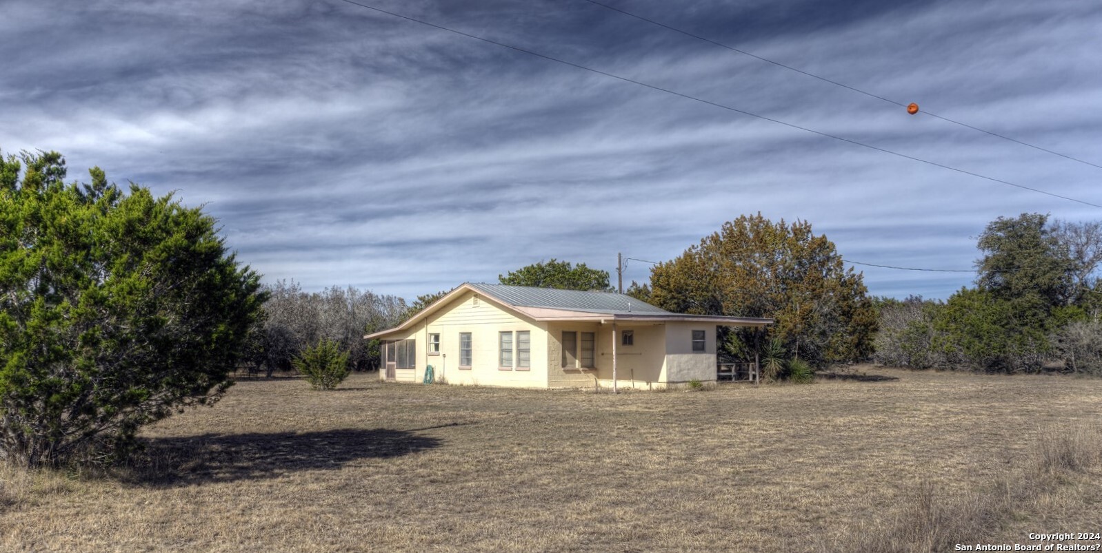 22 Squirrel Bend Uvalde, TX 78801 - Photo 2 of 47 a front view of house with yard and trees in the background