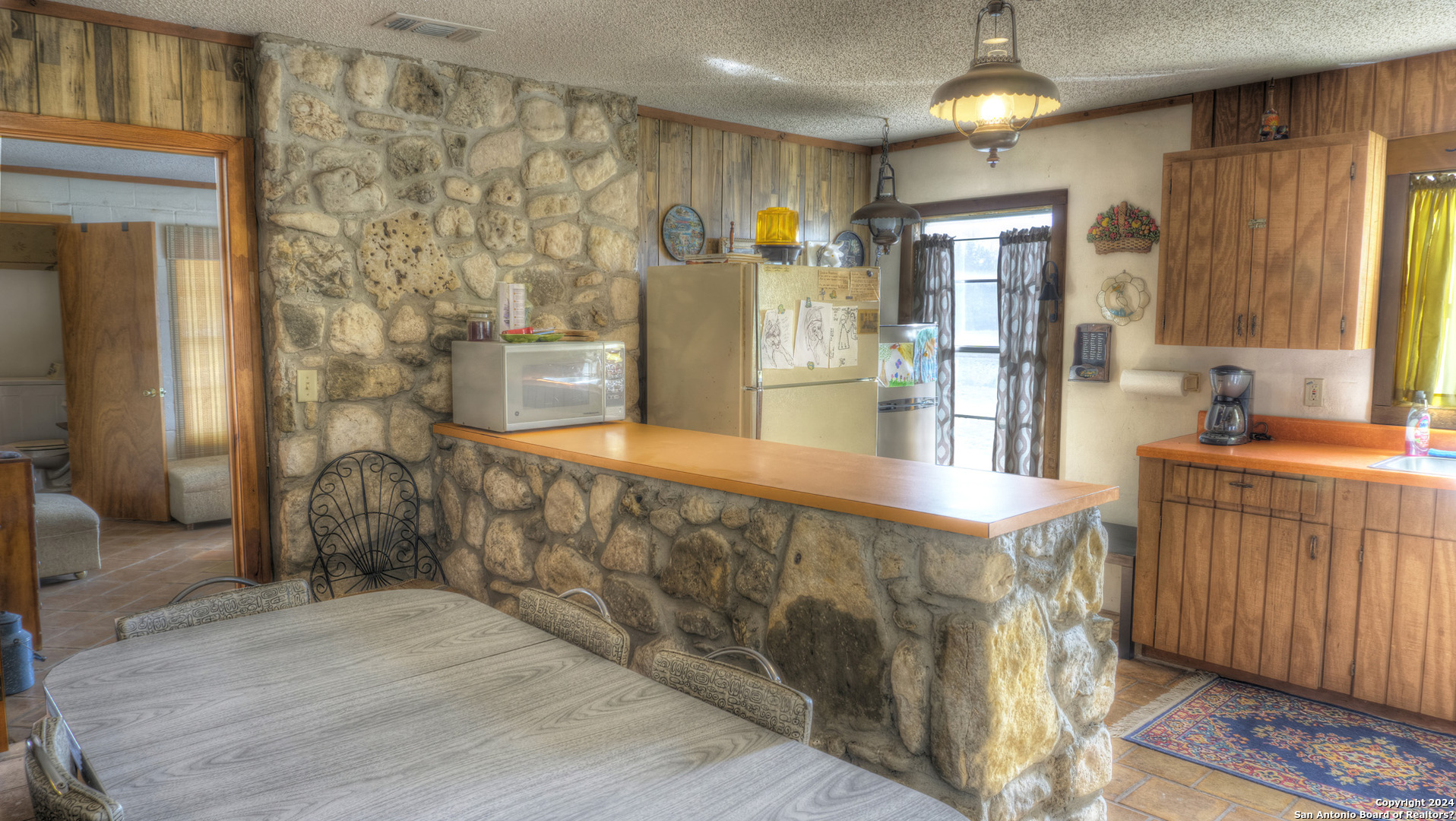 22 Squirrel Bend Uvalde, TX 78801 - Photo 25 of 47 a bathroom with a sink a mirror and a shower