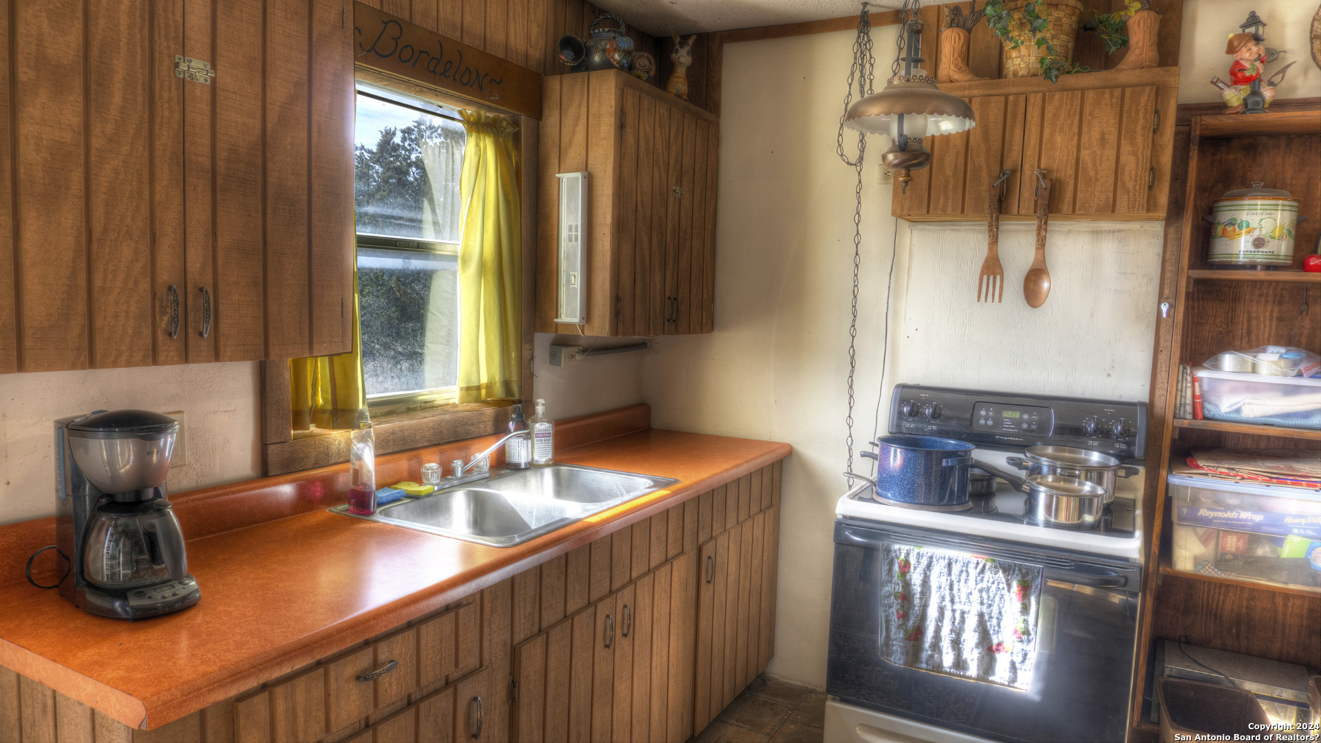 22 Squirrel Bend Uvalde, TX 78801 - Photo 27 of 47 a kitchen with a sink and a window