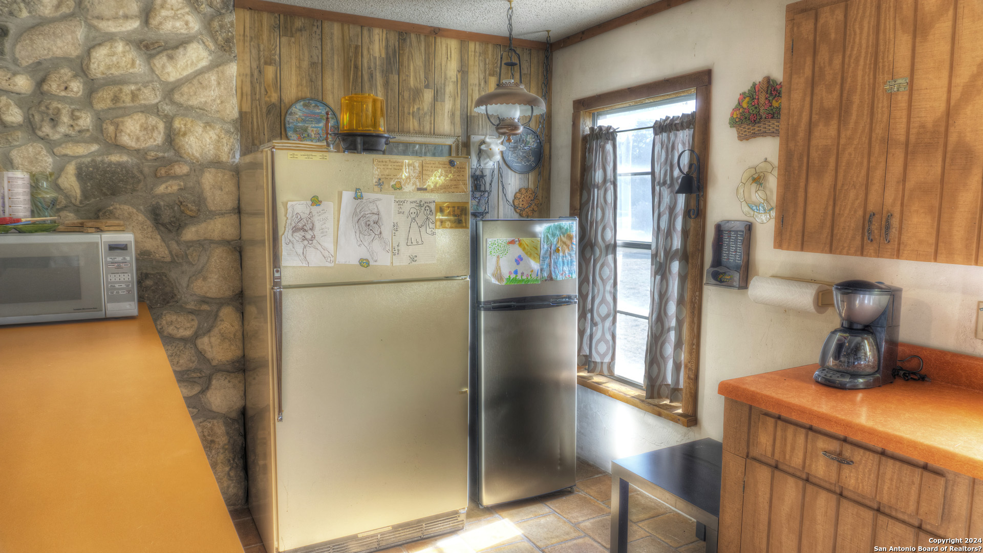 22 Squirrel Bend Uvalde, TX 78801 - Photo 28 of 47 a kitchen with a refrigerator and countertop