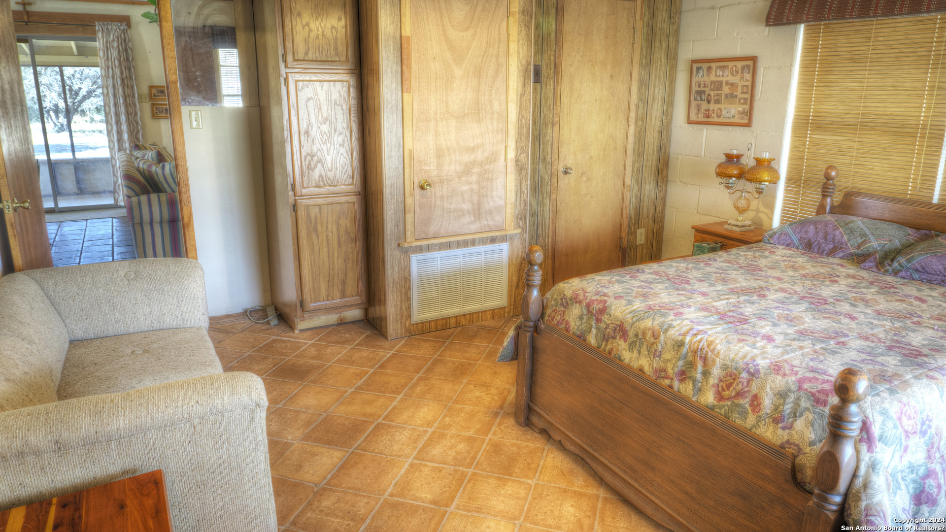 22 Squirrel Bend Uvalde, TX 78801 - Photo 30 of 47 a spacious bedroom with a bed and a couch