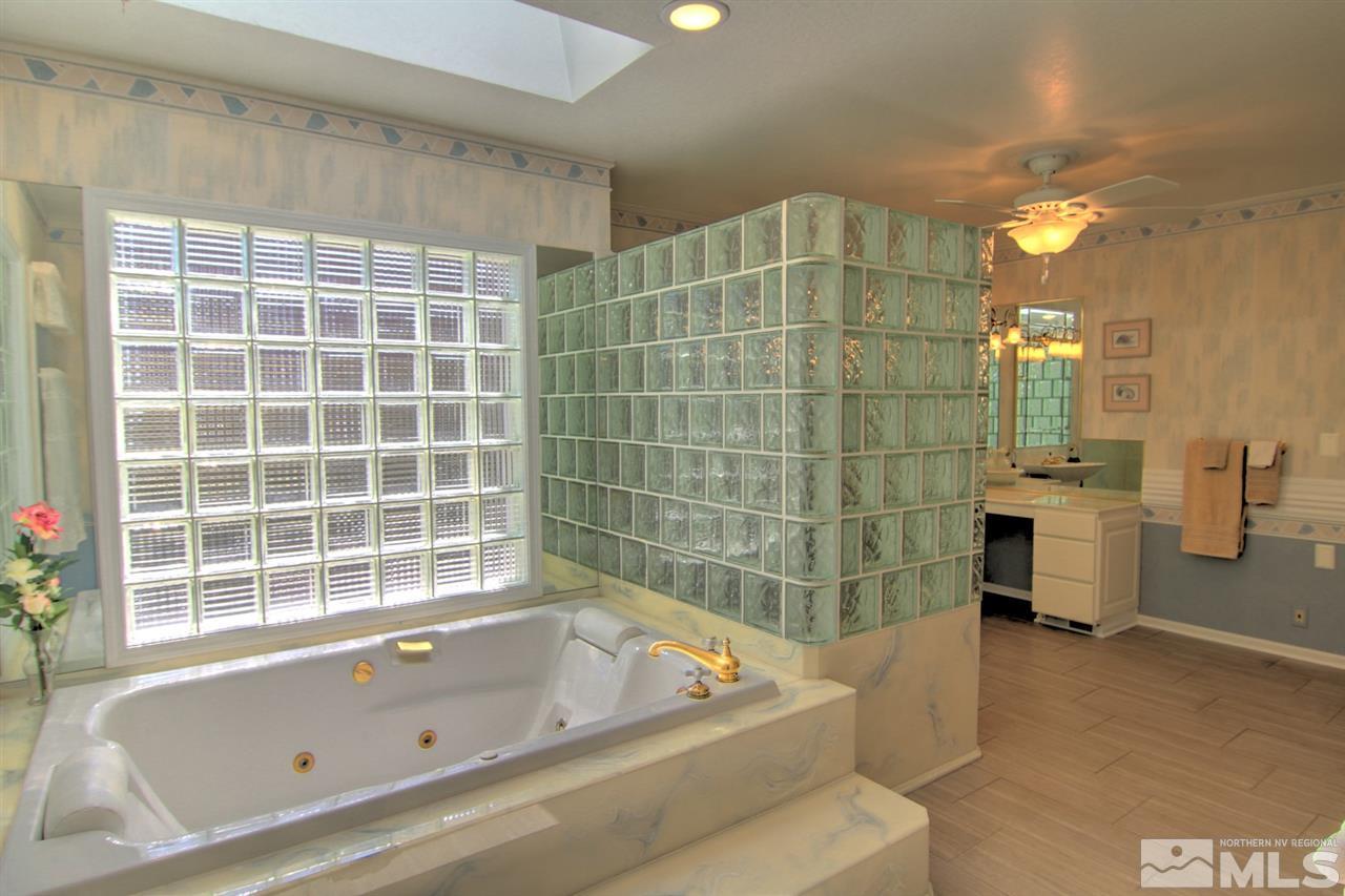 2340 Watt Street Reno, NV 89509 - Photo 21 of 25 a bathroom with a bathtub and a shower
