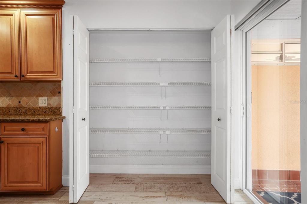 146 Boca Ciega Point Boulevard South, Unit 146 St. Petersburg, FL 33708 - Photo 8 of 14 a view of walk in closet with empty racks