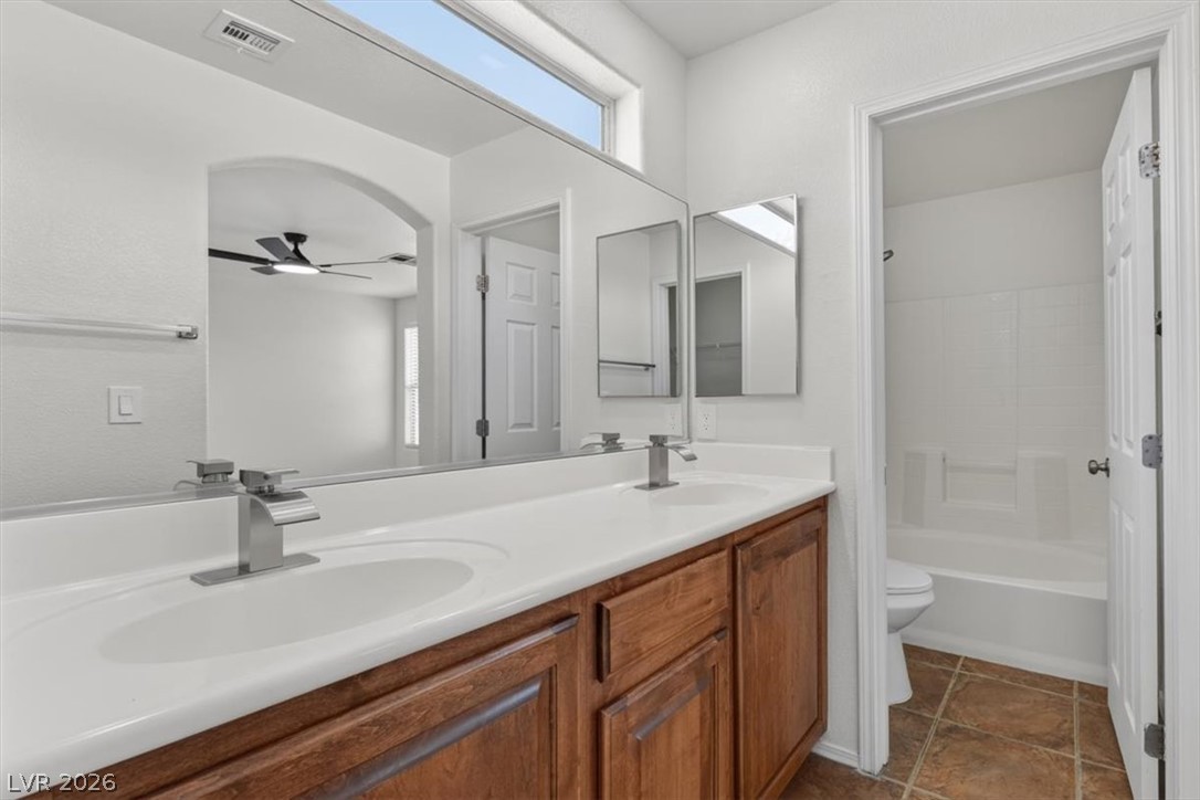 552 Albacate Street Henderson, NV 89015 - Photo 23 of 40 Double vanities and a large mirror enhance the functionality of this primary bathroom.