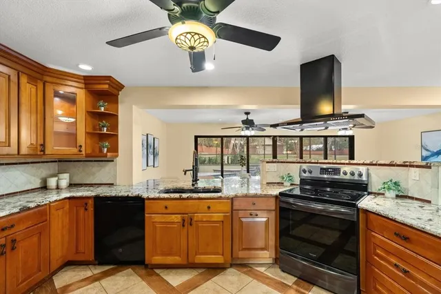 a kitchen with a stove and a sink