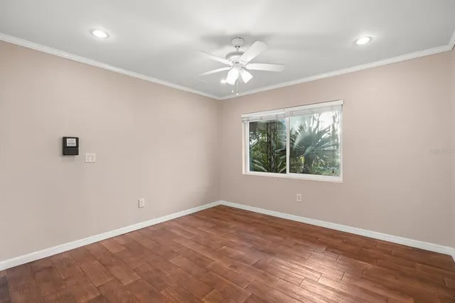 wooden floor in an empty room with a window