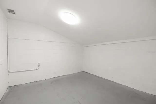 a view of a swimming pool with a yard