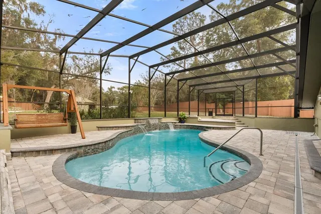 a view of a swimming pool with a patio