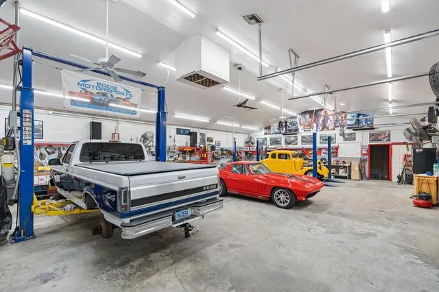 a view of a garage with parked cars